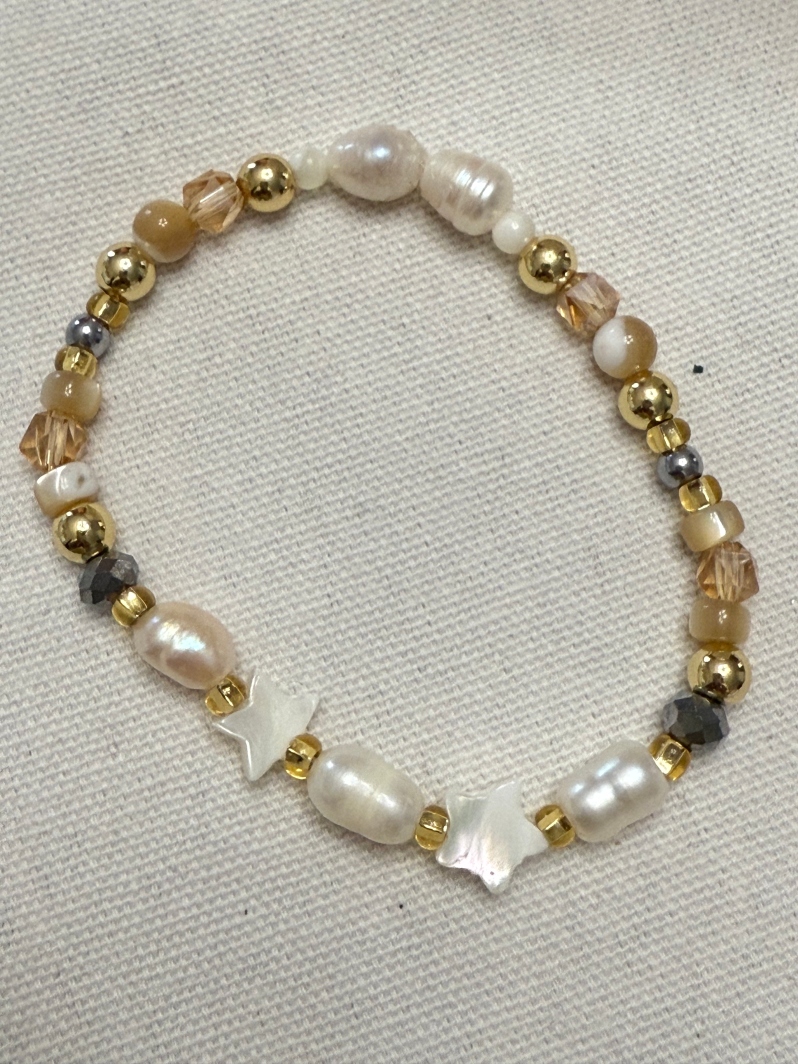 Product Description: This beautiful, unique bracelet is specially designed by Share's Program Director, Rose Carlson, for our annual Sunset Sips gala. Limited quantities available.</br> Bracelet